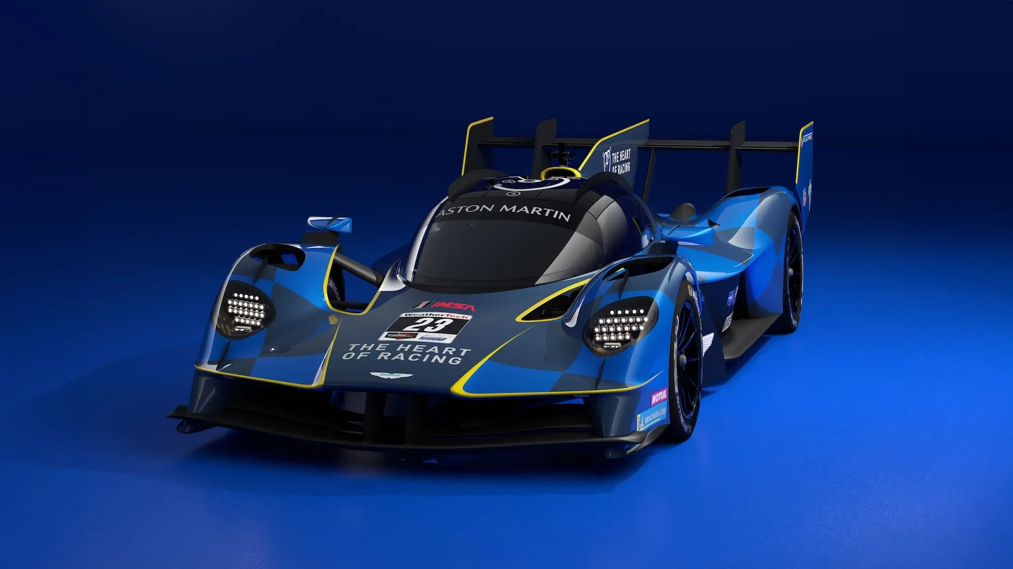 An image of the Aston Martin Valkyrie AMR-LMH, from the 3/4 view, in its blue IMSA livery.