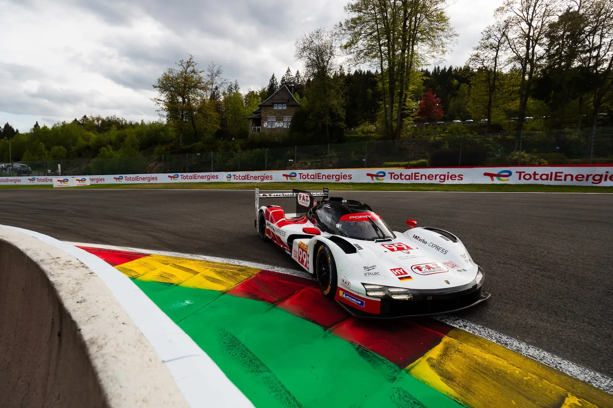 The #99 Proton Porsche 963 at La Source corner at Spa-Francorchamps in 2024.