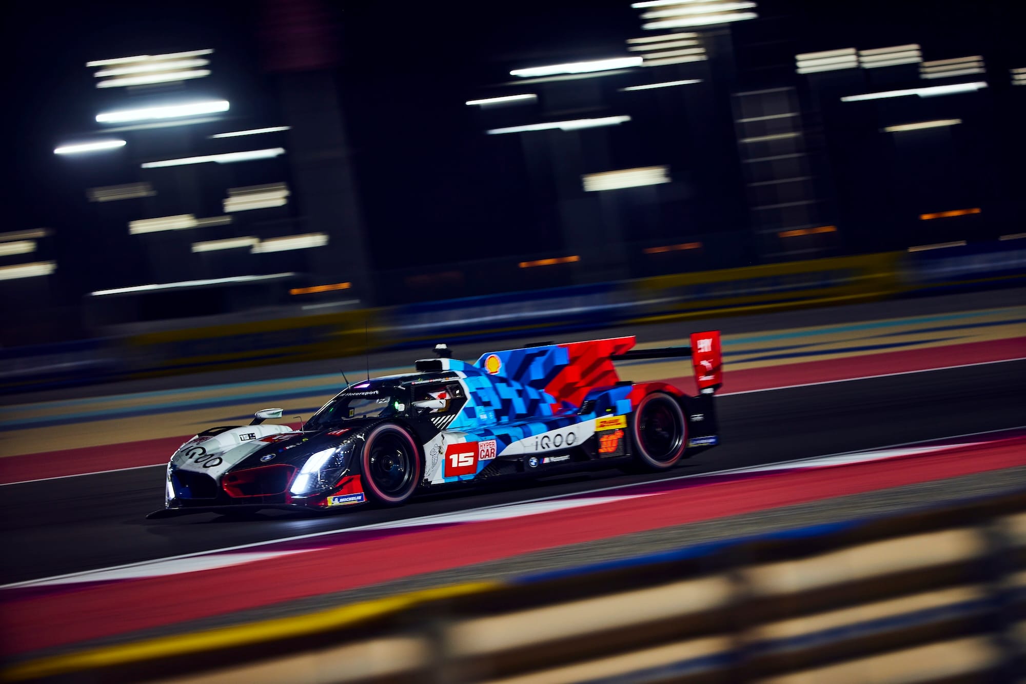 The #15 BMW M Hybrid V8 on track at Lusail International Circuit.